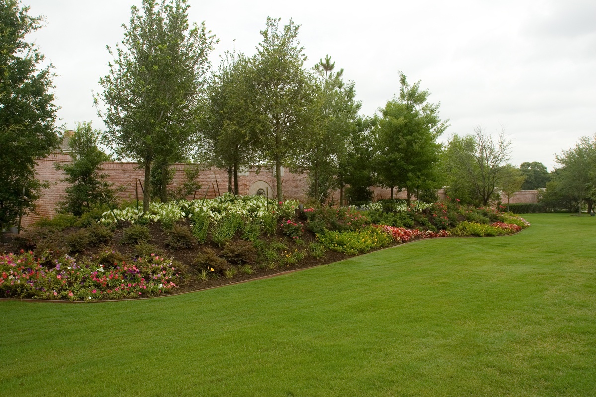 backyard garden and trees done by Green Earth DFW